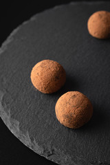 Chocolate truffles on a slate plate