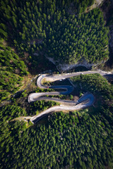 Drone view of winding forest road in the middle of Bicaz Gorge, Transylvania 