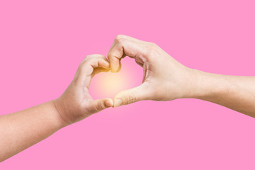 Man and child hands in the form of hearts, isolated on a pink background