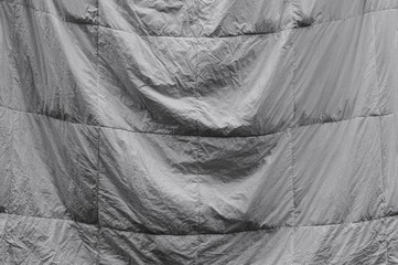 A white bed sheet hanging on the drying rack (Pesro, Italy, Europe)