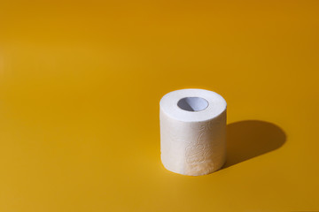 Creative still life with rolls of toilet paper, hot commodity during covid-19 and period of self...