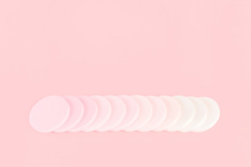 Tender candy pink monochrome feminine makeup tools and accessories. Blush powder and foundation applicator stack of sponges. Birthday beauty cosmetics blogger advert background concept. Copy space