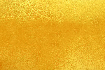 Gold colors painted on cement wall textured for background