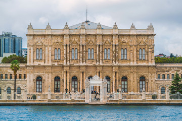 Fototapeta na wymiar Dolmabahce Palace in Istanbul. A tourist destination Istanbul Turkey. View of the Palace from the sea from the Bosphorus Strait