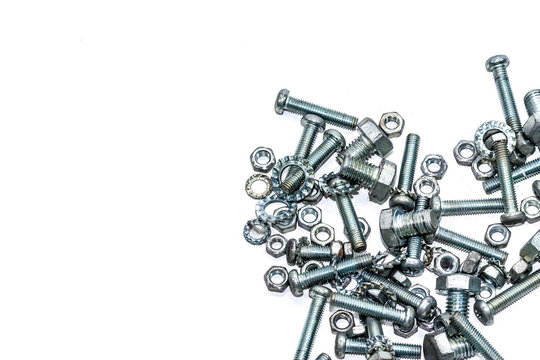 Close-up Of Nuts And Bolts On White Background