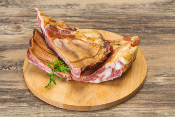 Smoked pork ribs over the wooden background