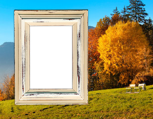 Old frame on beautiful autumn landscape background with forest, sky and mountains, mock up