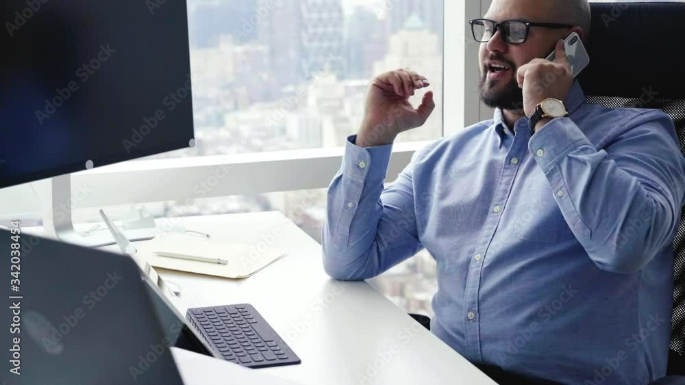 Poster businessman in spectacles making cellphone conversation with international enterprise partner using 