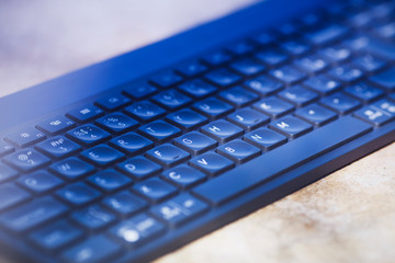 Close up detail view of computer keyboard. Remote work, business, office concept. Top view. Space for a text.