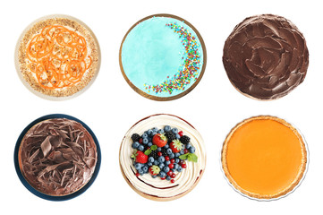 Set of different delicious cakes isolated on white, top view