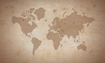 Silhouete de carte du monde sur la vieille surface de papier