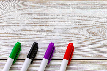 Several colored markers on a light background. Selective focus.