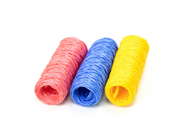 Hanks of colorful twine - pink, blue and yellow close up isolated on white background concept we're different. same things different colors diversity concept