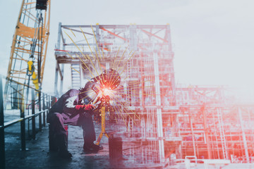 Worker welding process with welding spark light structure at Construction site project on crane...