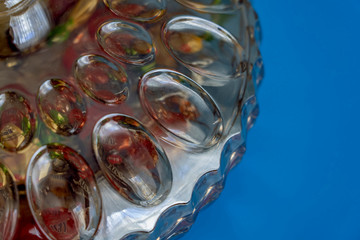 wave patterned glass bowl blue background