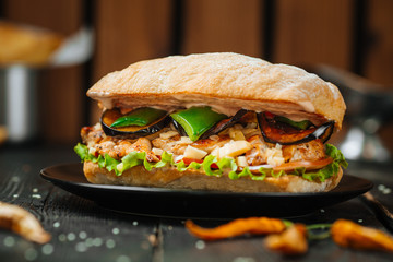 Tasty Sandwich on a dark wooden background