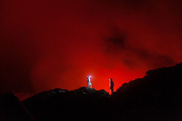 Democratic Republic of Congo - March 10, 2018. Tourists walking in front of the crater of Nyiragongo volcano