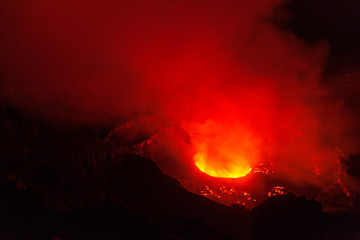 Amazing volcanic lava lake glowing at night