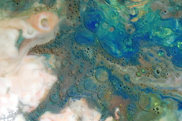 Abstract liquid ink marble color waves and bubbles