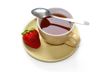 Ripe strawberries and a beige clay cup isolated on a white background.