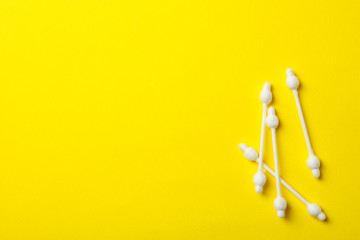 Baby ear sticks on yellow background. Hygiene