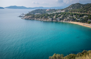 Clear Blue water of white sea with a village on front line.