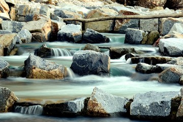 Small soft waterfalls of a fish bridge