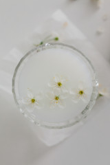 spring cherry blossoms on a white table with a book