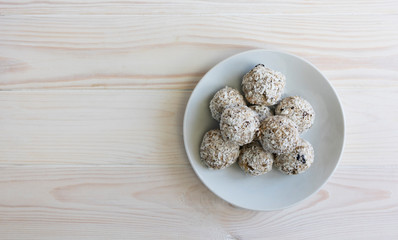 Healthy Breakfast Concept, Healthy organic energy granola bites with nuts, cacao, banana and honey - vegan vegetarian raw snack or meal