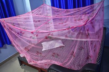 Mosquito net in the room. Head protection from biting insects in a hike in the woods or forest in...