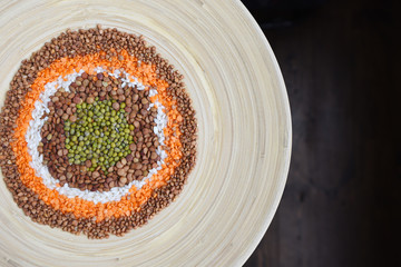 Colorful cereals in circles. lentils, buckwheat, rice, green gram. Flat lay