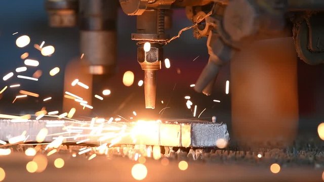 Gas plasma cutting. Metal machining with sparks on CNC maching