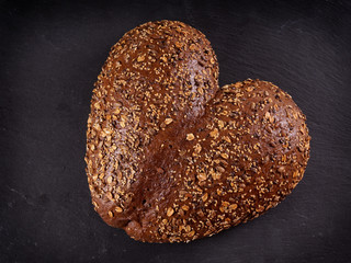 heart shaped bread loaf for Valentine's day on slate board