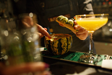 the bartender prepares a cocktail in the style of Halloween
