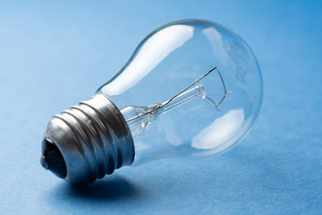 light bulb on blue background close-up
