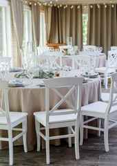Fototapeta na wymiar Romantic Wedding Table. Luxury elegant table setting dinner in a restaurant