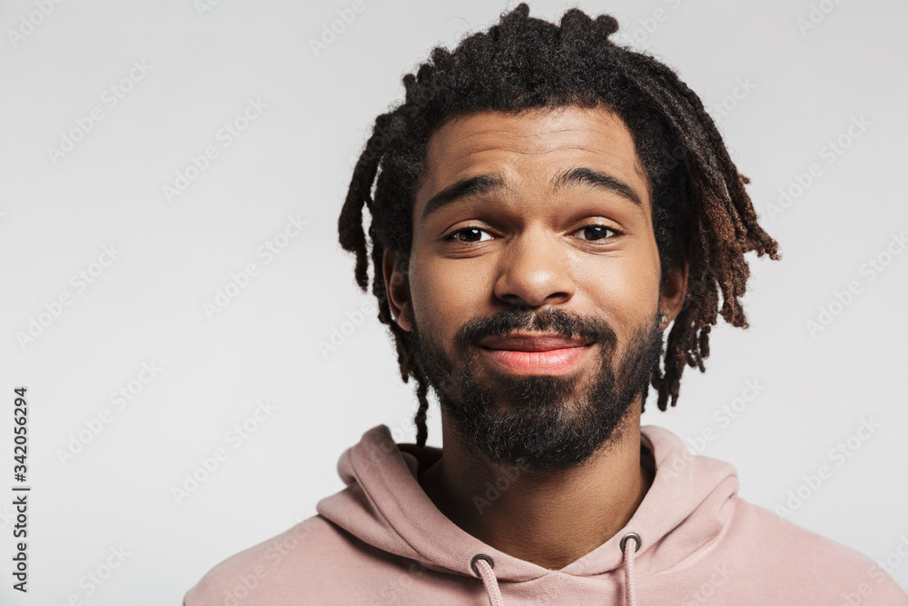 Wall mural Portrait of a young african man wearing hoodie