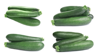 Set of fresh ripe zucchinis on white background