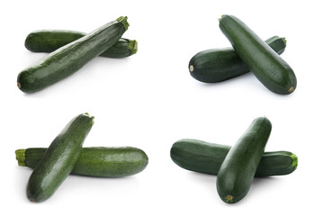 Set of fresh ripe zucchinis on white background