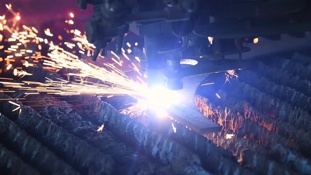 Gas plasma cutting. Metal machining with sparks on CNC maching