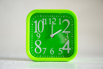 green clock on white background