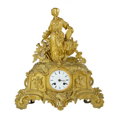 Vintage antique golden table clock. Bronze fireplace watch in gilding isolated on white background....