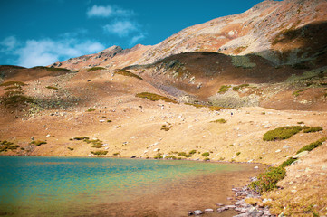 Emerald lake in mountains. Arkhyz, Karachay-Cherkessia