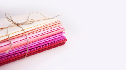 Stack of Tissue paper warm colors on white background. Banner with copy space. Concept of...