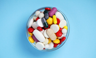 A bowl with colorful medicine pills