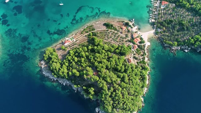 Aerial footage of Korcula island landscape and turquoise Gradina cove near Vela Luka, archipelago of southern Dalmatia, Croatia