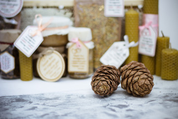 pine cones on the background of honey products