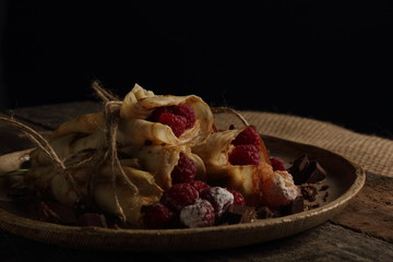 delicious pancakes on a black background in rustic style