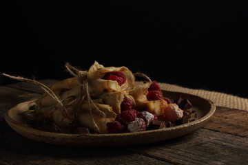 delicious pancakes on a black background in rustic style