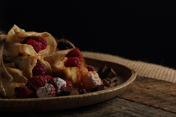 delicious pancakes on a black background in rustic style